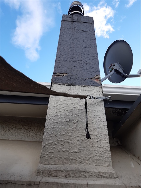 Damaged chimney flashing leaking into roof