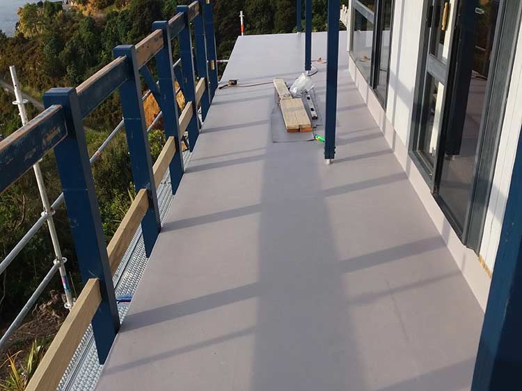 TPO rubber membrane roof installation on low-pitch roof