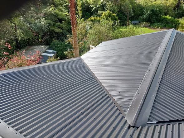 New dark Colorsteel long-run roof after decramastic replacement