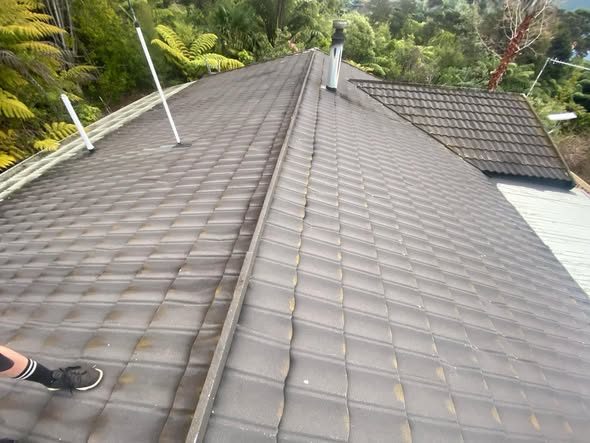 Worn decramastic pressed metal tile roof before replacement