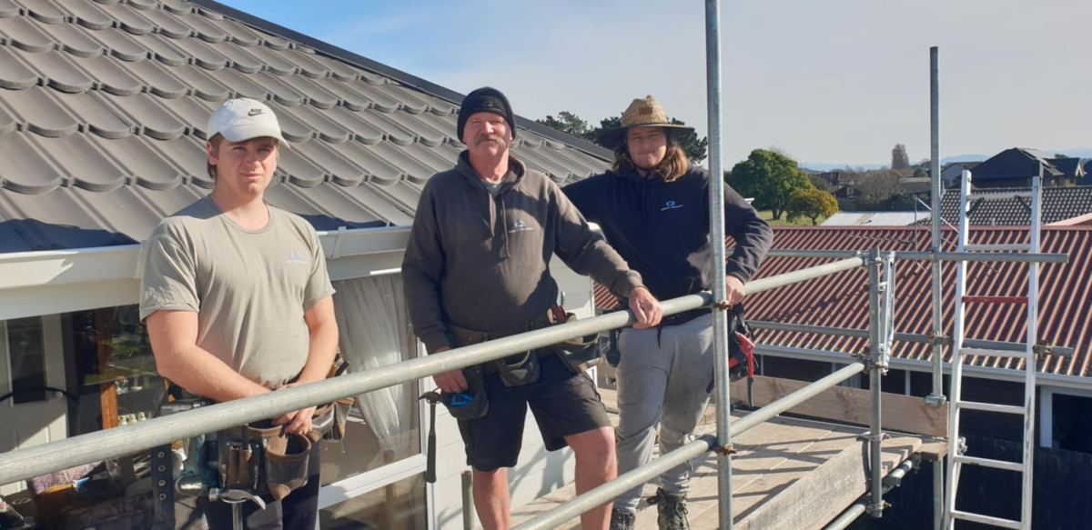 The Quality Roofing crew on the scaffold at a South Island job