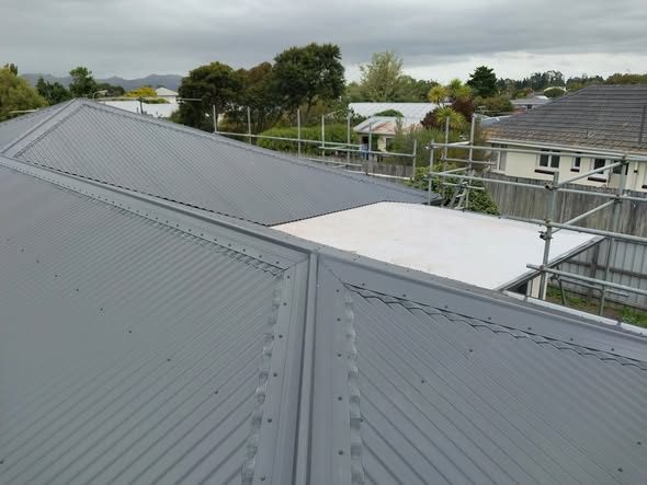 New Colorsteel corrugate roof with TPO membrane section in Burwood